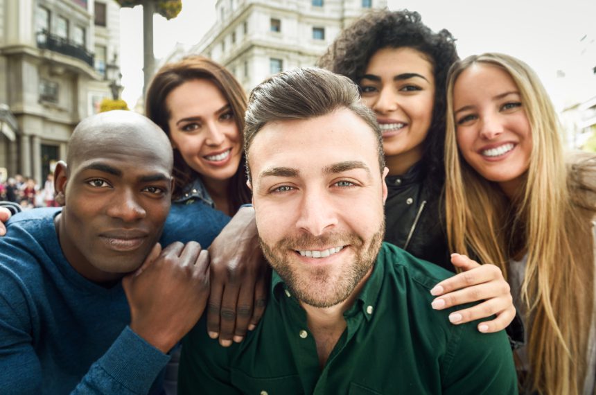 A group of people that are posing for the camera